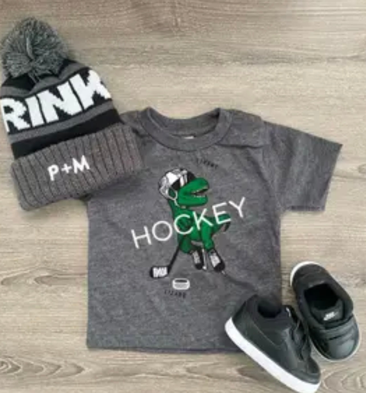 Portage and Main T-Rex hockey tee